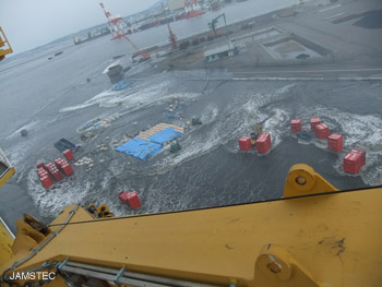 Water pouring over the Hachinohe seawall